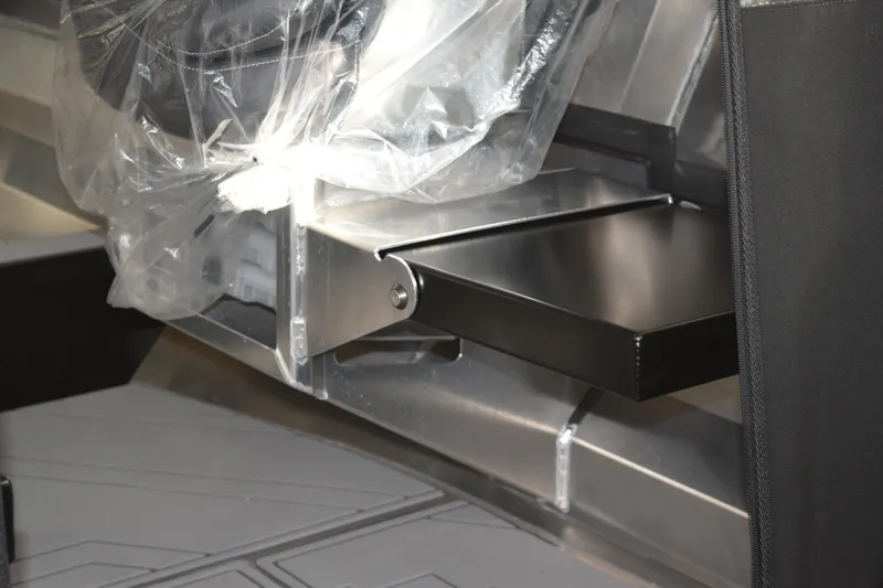 Slide: The Image of 2026 Stabicraft 1550 Fisher Offshore interior detail with protective plastic covering. - 23