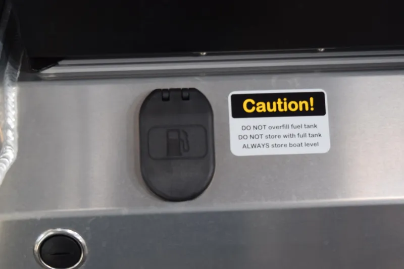 Slide: The Image of Fuel cap and caution label on 2026 Stabicraft 1550 Fisher Offshore boat. - 25