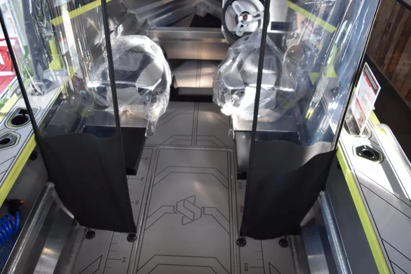 Slide: The Image of 2026 Stabicraft 1550 Fisher Offshore interior with modern seating and steering wheel. - 3