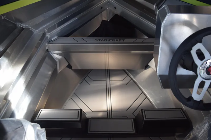 Slide: The Image of 2026 Stabicraft 1550 Fisher Offshore interior with sleek aluminum design and steering wheel. - 6