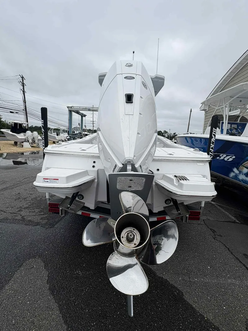 Slide: The Image of 2026 Blackfin 262 HB boat rear view with powerful outboard motor. - 17