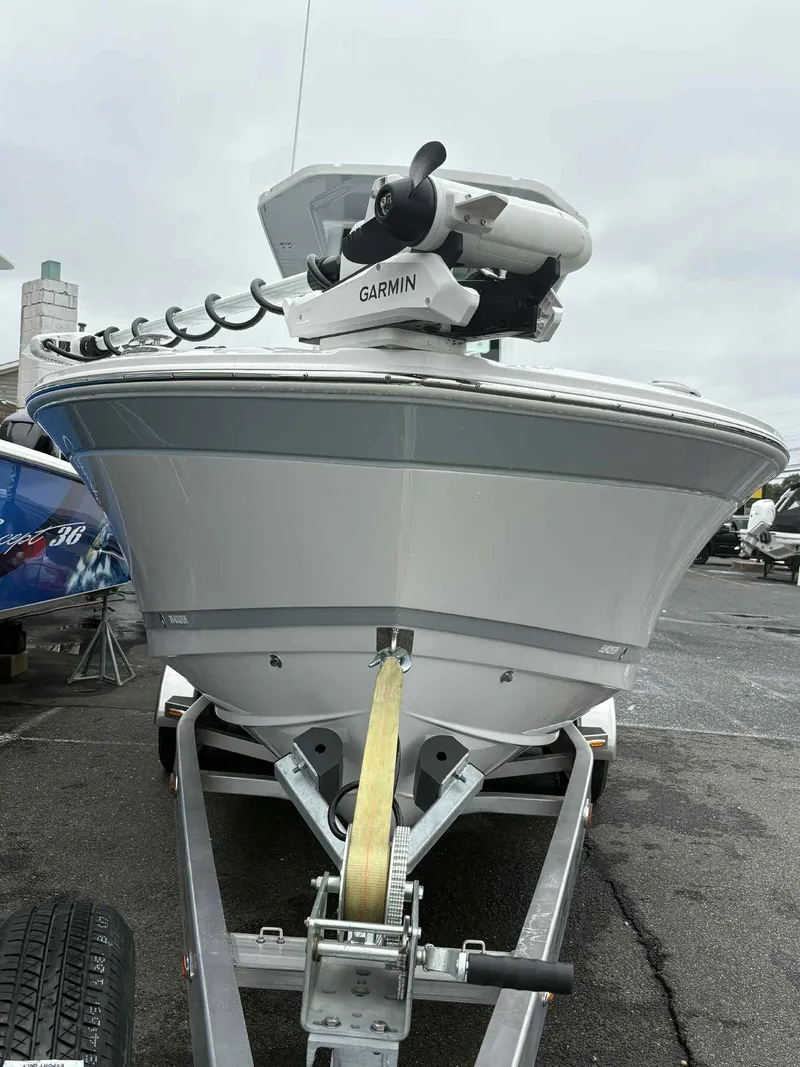 Slide: The Image of 2026 Blackfin 262 HB boat on trailer with Garmin equipment, parked outdoors. - 19