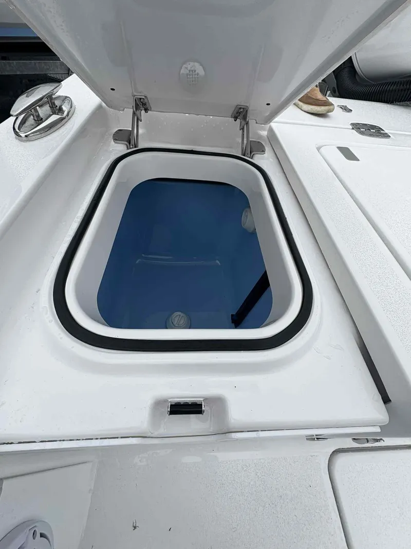 Slide: The Image of Open hatch on 2026 Blackfin 262 HB boat, revealing storage compartment. - 5