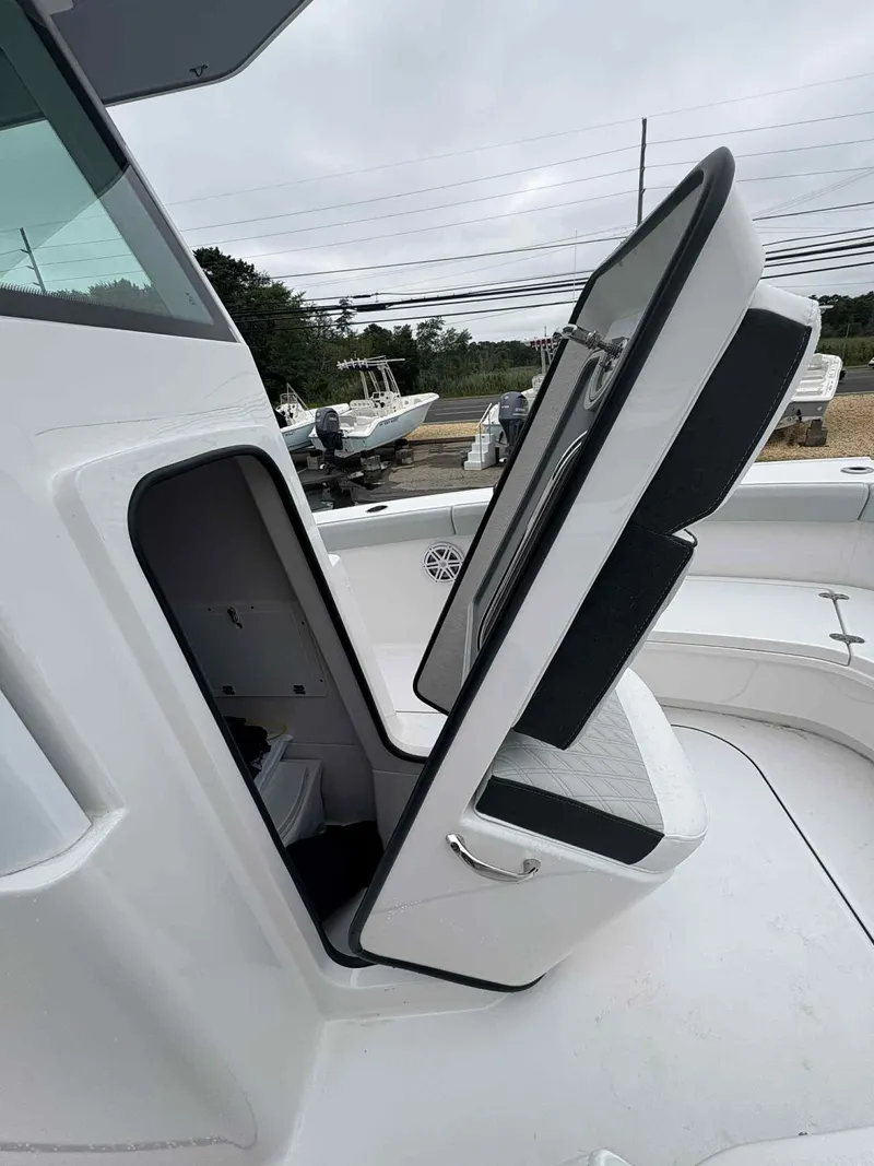 Slide: The Image of 2026 Blackfin 262 HB boat with open storage compartment on deck. - 6