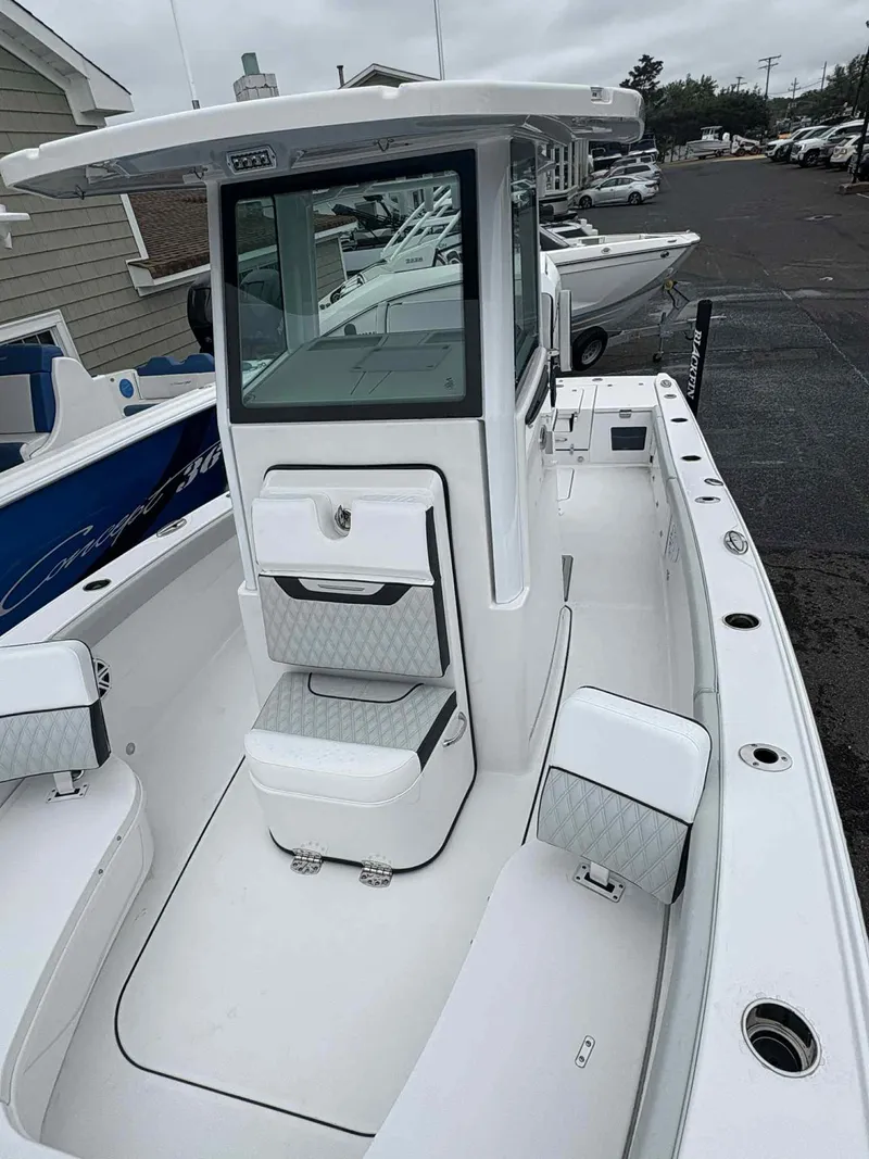 Slide: The Image of 2026 Blackfin 262 HB boat with sleek white interior and modern design. - 8