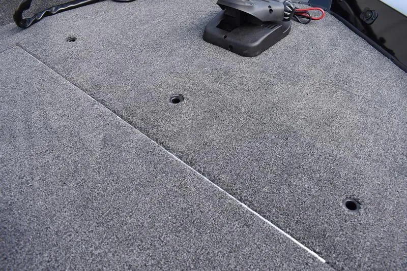 Slide: The Image of Carpeted deck of 2026 Lowe Skorpion 17 boat with mounting holes. - 14