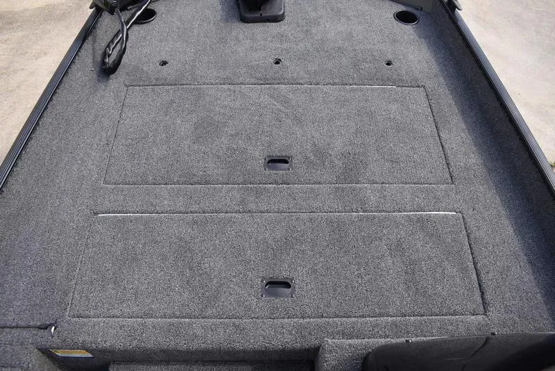 Slide: The Image of Carpeted deck of 2026 Lowe Skorpion 17 boat with storage compartments. - 15
