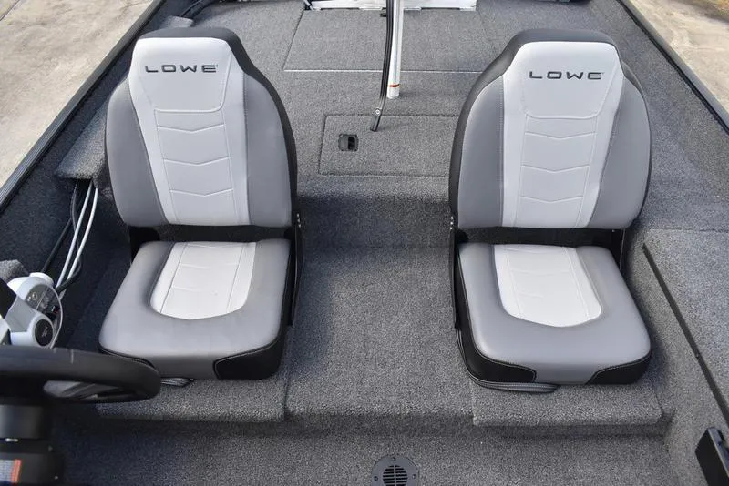 Slide: The Image of 2026 Lowe Skorpion 17 boat interior with two gray and white seats. - 26