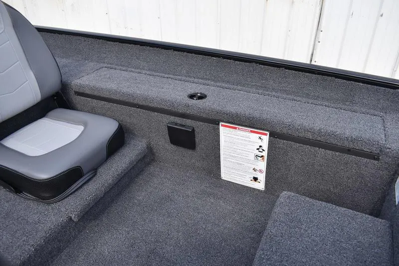 Slide: The Image of 2026 Lowe Skorpion 17 boat interior with gray seating and carpeted flooring. - 28