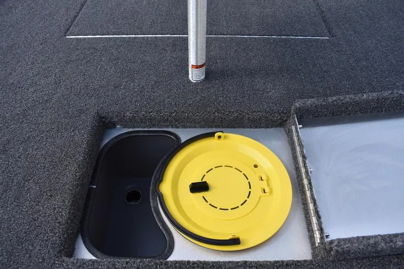 Slide: The Image of 2026 Lowe Skorpion 17 boat deck with yellow hatch cover and storage compartment. - 33