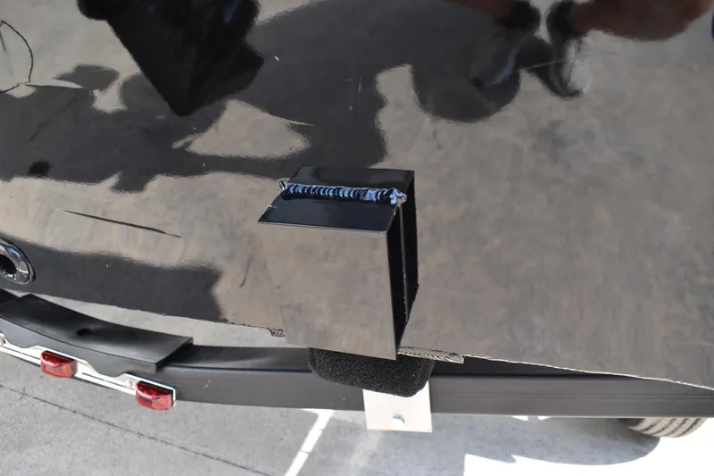 Slide: The Image of Close-up of Lowe Skorpion 17 boat detail, 2026 model, showing a black metal component. - 8