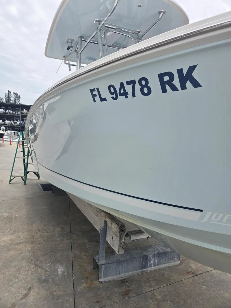 Slide: The Image of 2015 Jupiter 26 FS boat on dry dock with registration FL 9478 RK. - 17