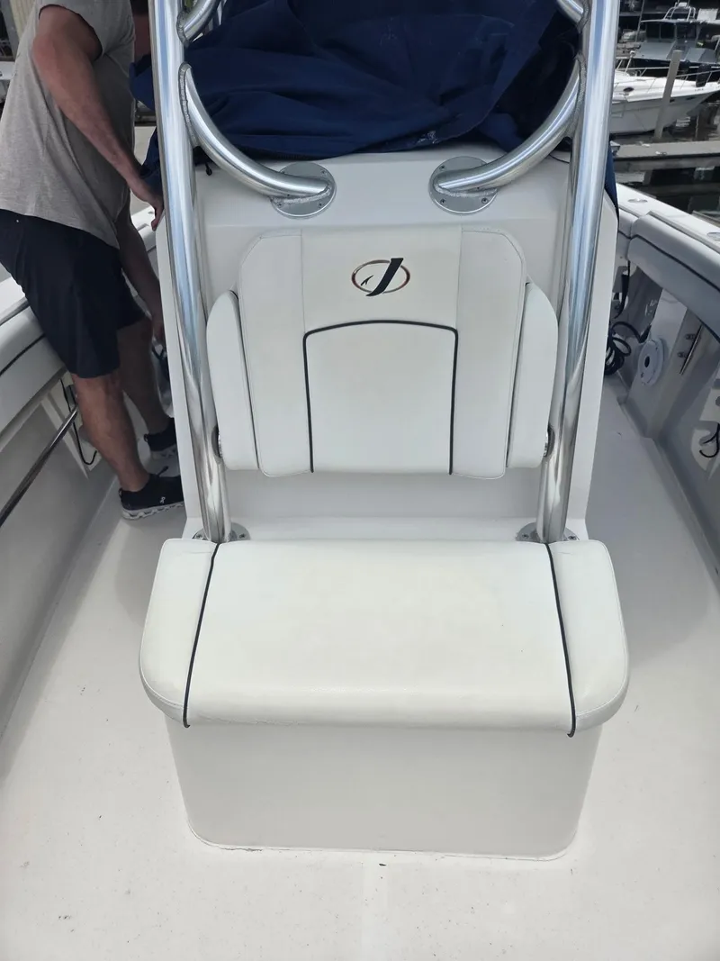 Slide: The Image of 2015 Jupiter 26 FS boat seat with stainless steel frame and white upholstery. - 21