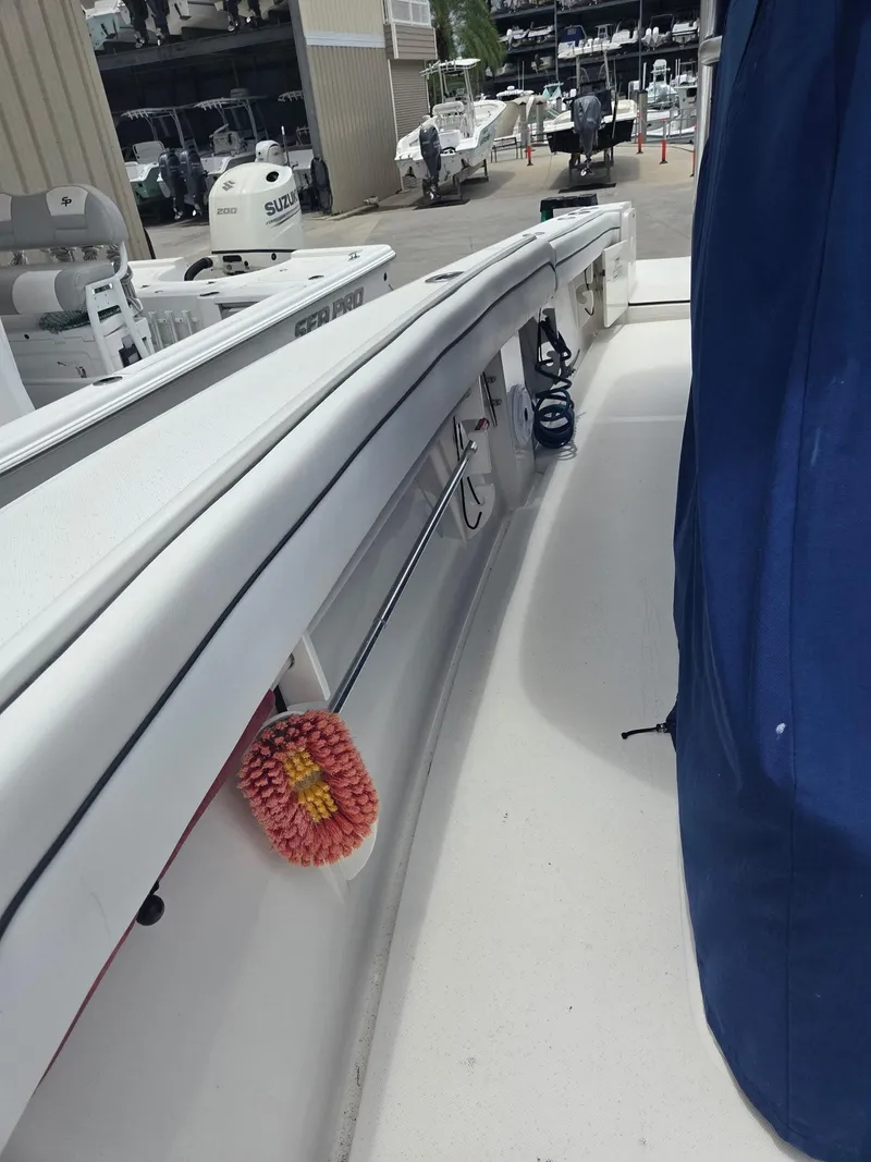 Slide: The Image of 2015 Jupiter 26 FS boat interior with cleaning brush and blue cover. - 25