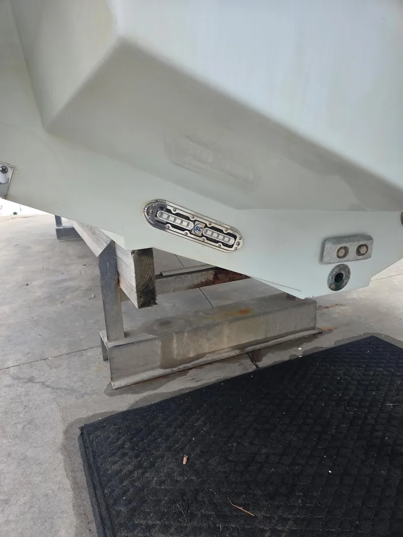 Slide: The Image of 2015 Jupiter 26 FS boat hull on a stand, showing underwater lighting. - 30