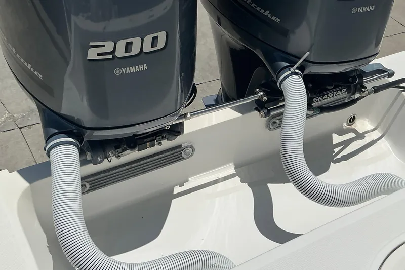 Slide: The Image of Twin Yamaha 200 outboard engines on a 2015 Jupiter 26 FS boat. - 34