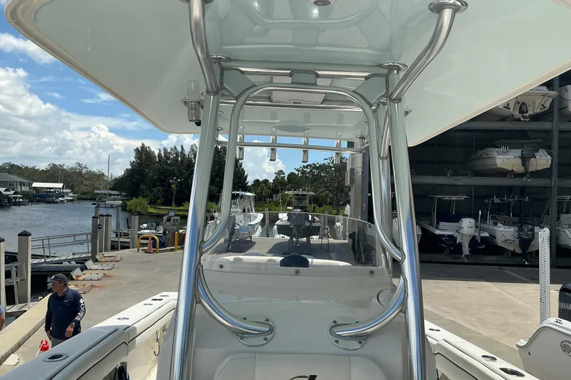 Slide: The Image of 2015 Jupiter 26 FS boat docked at marina with clear skies. - 37