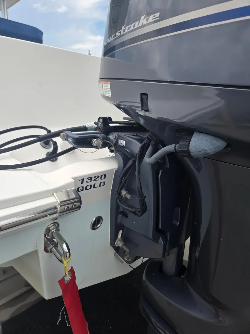 Slide: The Image of Outboard motor on a 2015 Jupiter 26 FS boat, featuring a Yamaha engine. - 4