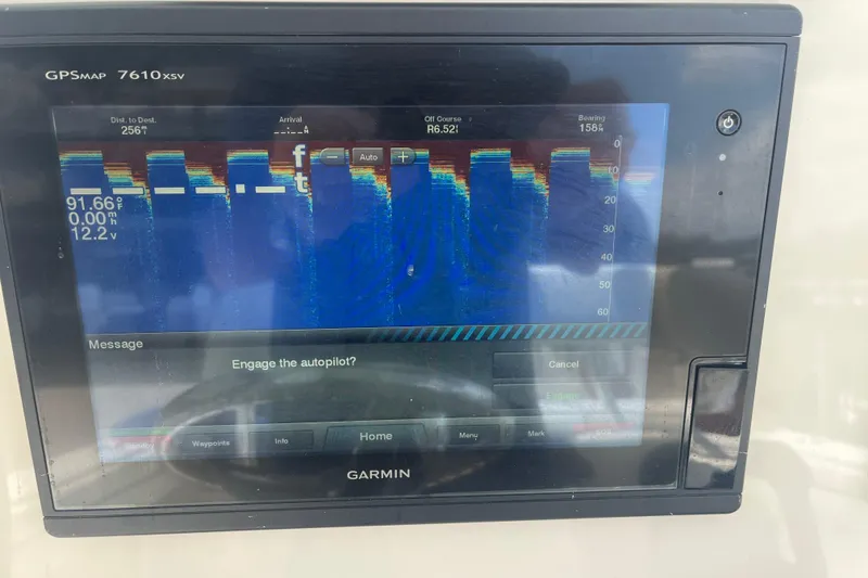 Slide: The Image of Garmin GPSMAP 7610xsv display on 2015 Jupiter 26 FS boat, showing sonar and autopilot options. - 53