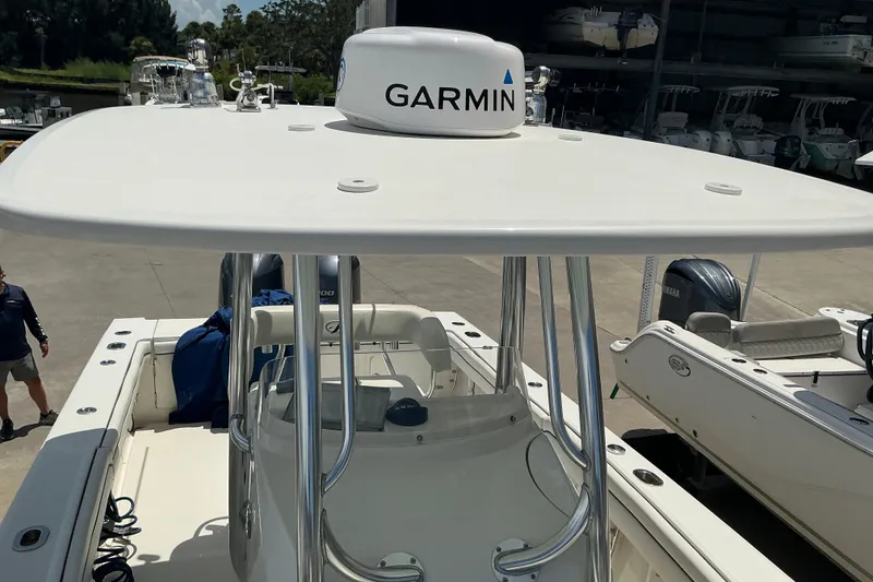 Slide: The Image of 2015 Jupiter 26 FS boat with Garmin equipment, docked in a marina. - 55
