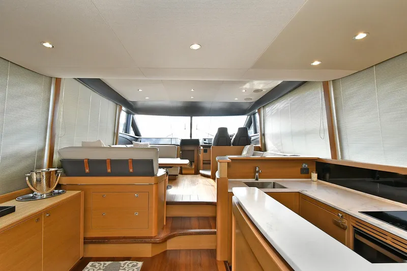Slide: The Image of Luxurious interior of 2016 Princess 52 Flybridge Yacht with modern kitchen and seating area. - 16