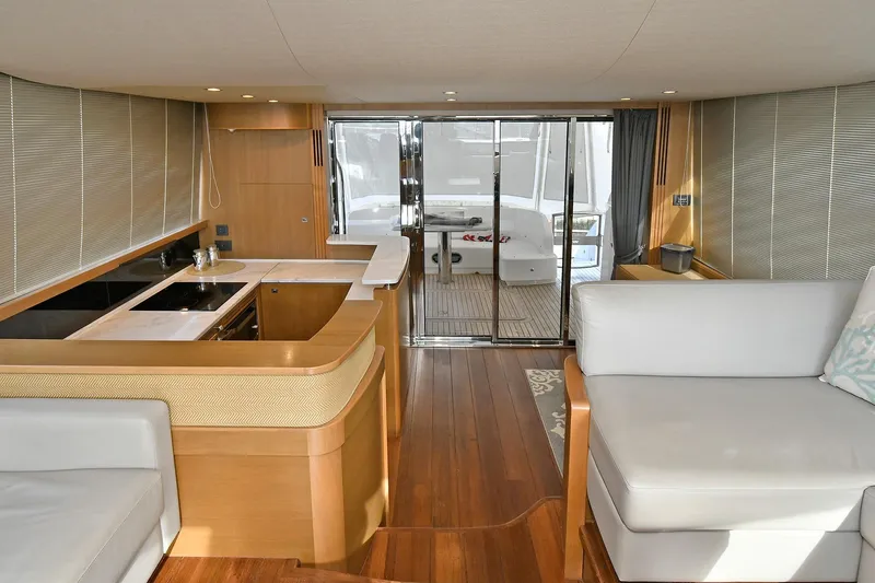 Slide: The Image of Luxurious interior of a 2016 Princess 52 Flybridge Yacht with modern kitchen and seating area. - 18