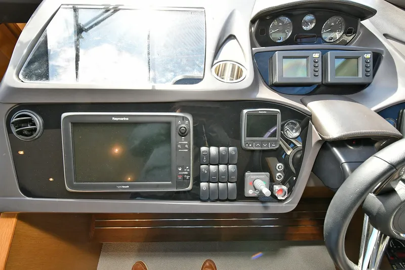 Slide: The Image of Control panel of a 2016 Princess 52 Flybridge Yacht with navigation and monitoring systems. - 23