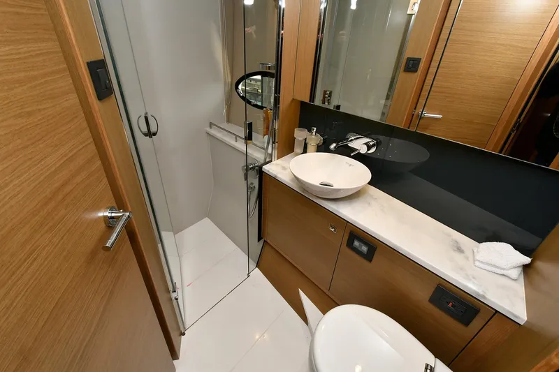 Slide: The Image of Luxurious bathroom in 2016 Princess 52 Flybridge Yacht with modern fixtures and elegant design. - 27