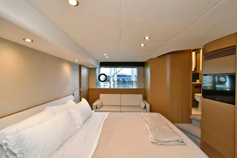 Slide: The Image of Luxurious bedroom interior of 2016 Princess 52 Flybridge Yacht with modern design and cozy ambiance. - 32