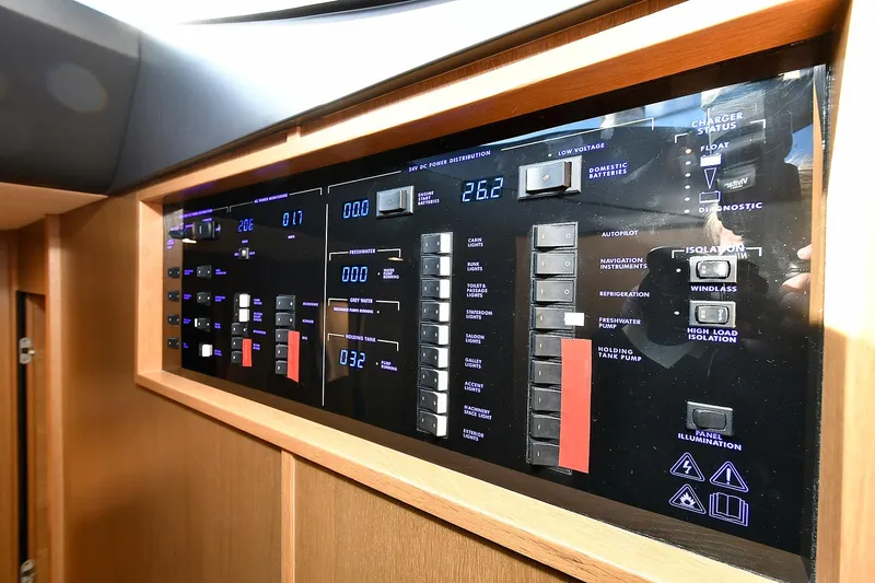 Slide: The Image of Control panel of a 2016 Princess 52 Flybridge Yacht, featuring illuminated switches and displays. - 36