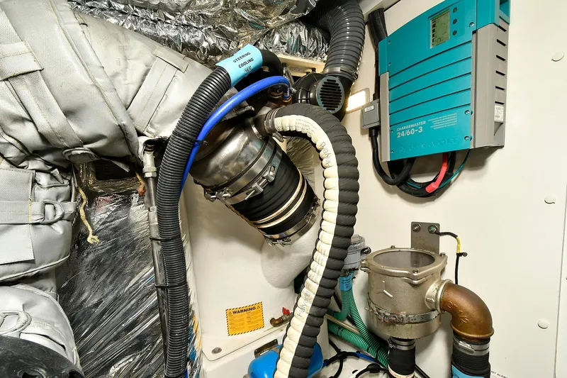 Slide: The Image of Engine room of 2016 Princess 52 Flybridge Yacht with mechanical components and wiring. - 38