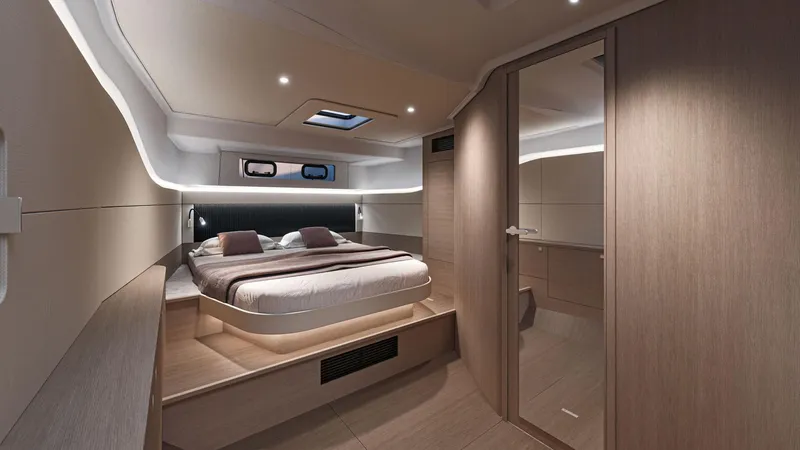 Slide: The Image of Luxurious cabin interior of 2026 Beneteau Gran Turismo 40 yacht, featuring modern design and cozy bedding. - 8
