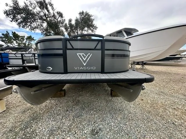 Slide: The Image of 2023 Viaggio Lago C pontoon boat displayed on gravel lot. - 9