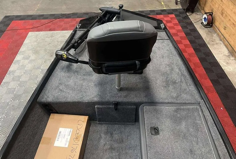 Slide: The Image of 2026 Tracker BASS TRACKER® Classic XL boat interior with seat and storage compartments. - 5