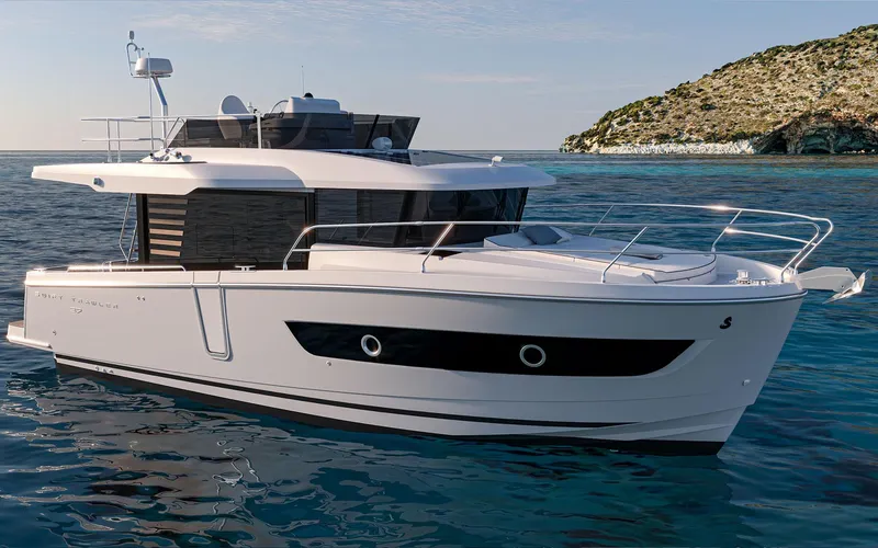 The Image of 2026 Beneteau 37 Swift Trawler cruising near rocky coastline. - 0