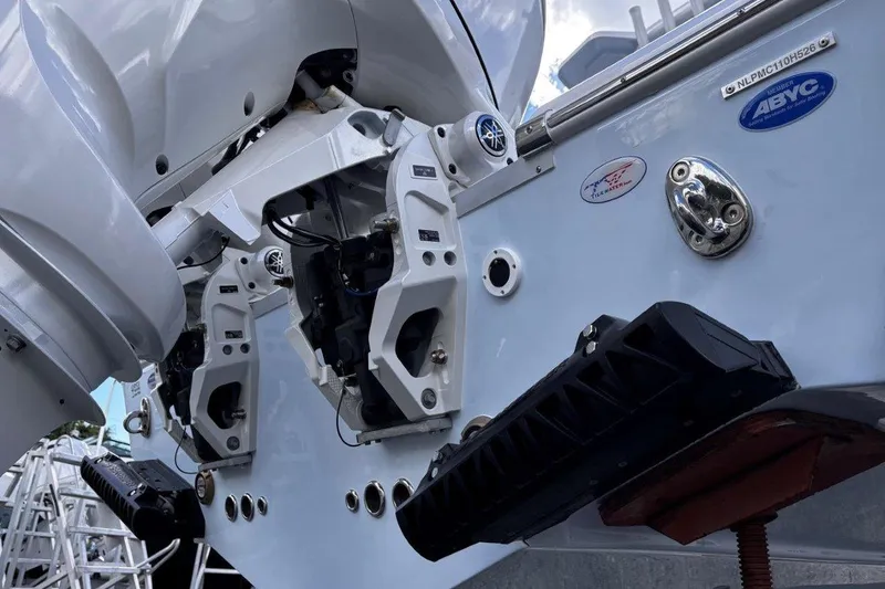 Slide: The Image of 2026 Tidewater 256 CC Adventure boat engine and transom details. - 10