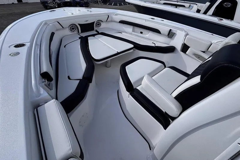 Slide: The Image of 2026 Tidewater 256 CC Adventure boat interior with sleek seating and modern design. - 32
