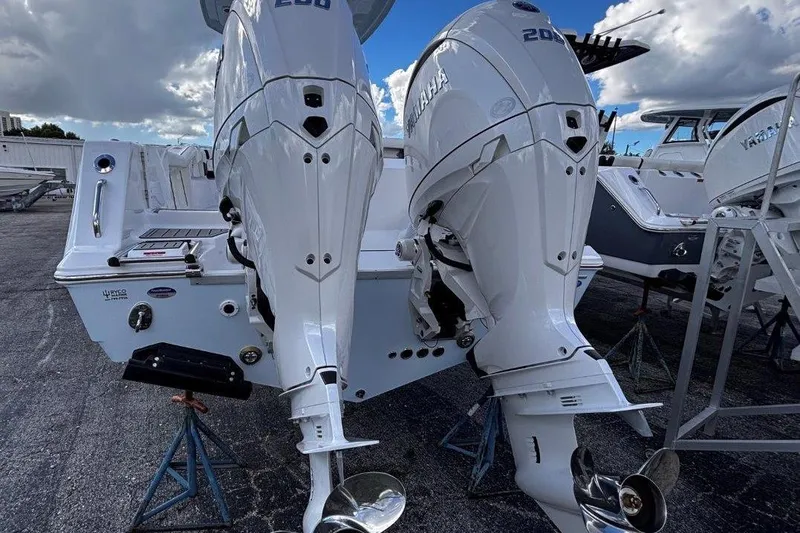 Slide: The Image of 2026 Tidewater 256 CC Adventure boat with dual Yamaha outboard engines. - 9