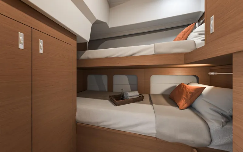 Slide: The Image of 2026 Beneteau 37 Swift Trawler cabin with cozy bunk beds and wooden interior. - 13