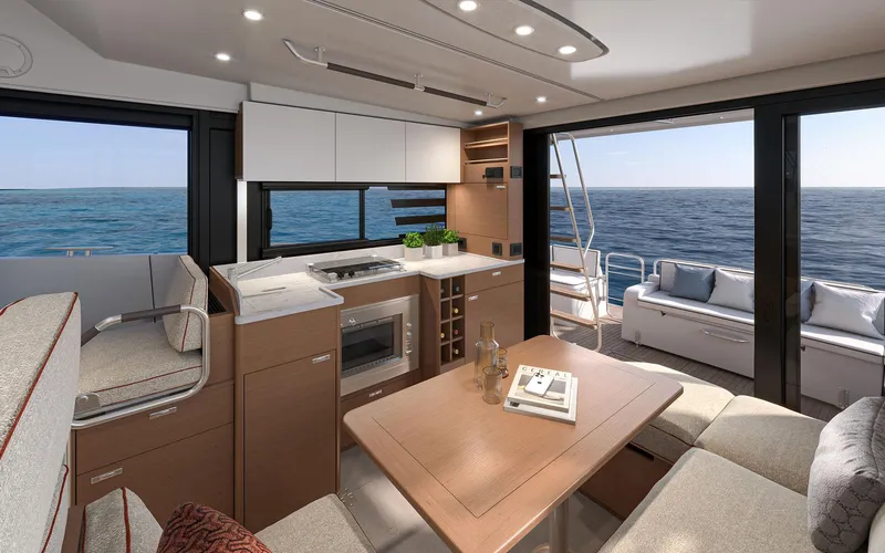 Slide: The Image of Interior of 2026 Beneteau 37 Swift Trawler with modern kitchen and ocean view. - 8