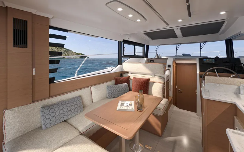 Slide: The Image of Luxurious interior of 2026 Beneteau 37 Swift Trawler with modern seating and ocean view. - 9