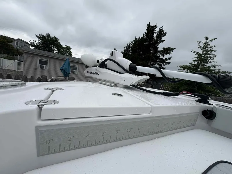 Slide: The Image of 2026 Blackfin 242HB boat deck with Garmin equipment, overcast sky background. - 20