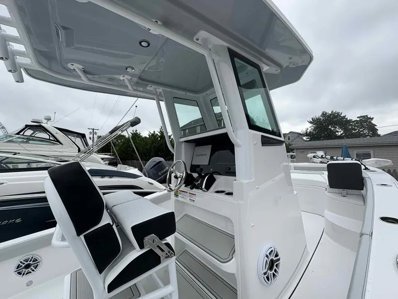 Slide: The Image of 2026 Blackfin 242HB boat interior with modern helm and seating. - 9