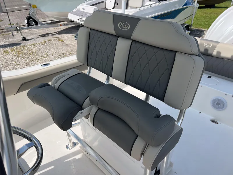 Slide: The Image of 2025 Key West 239 FS boat seat with gray upholstery and diamond stitching. - 10