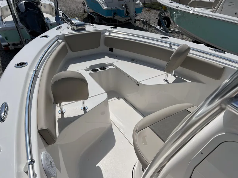 Slide: The Image of 2025 Key West 239 FS boat interior with seating and cup holders. - 12