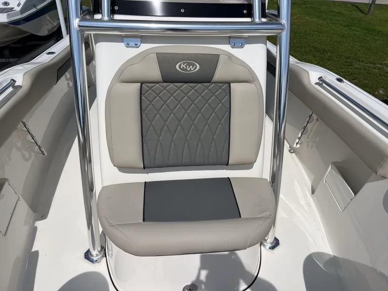 Slide: The Image of 2025 Key West 239 FS boat seat with gray and beige upholstery, featuring diamond stitching. - 13