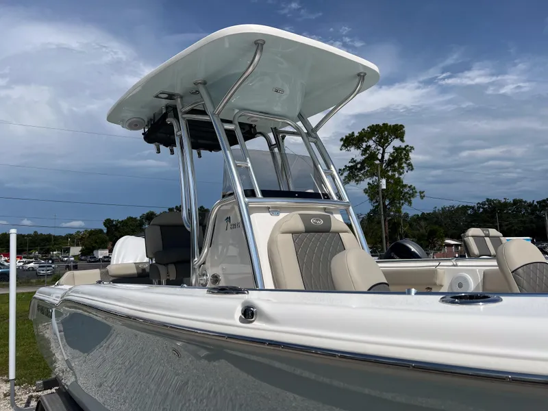 Slide: The Image of 2025 Key West 239 FS boat with sleek design and modern features under a clear sky. - 2