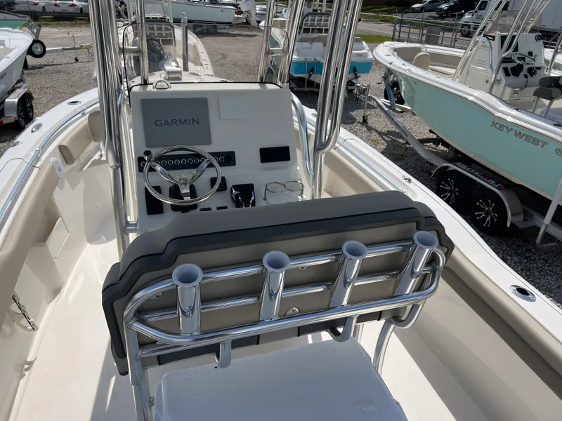 Slide: The Image of 2025 Key West 239 FS boat interior with Garmin navigation system and rod holders. - 6