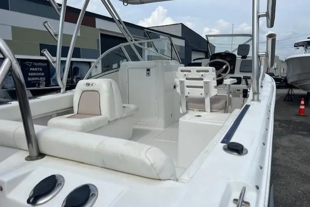 Slide: The Image of 2013 Sea Hunt Escape 211 LE boat interior with seating and steering console. - 17
