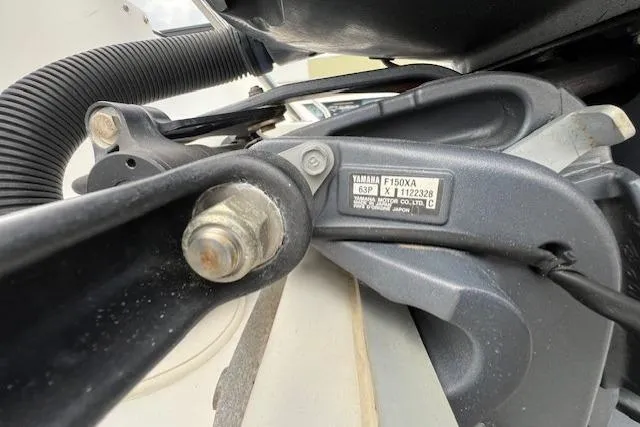 Slide: The Image of Close-up of a Yamaha F150XA engine part on a 2013 Sea Hunt Escape 211 LE boat. - 19